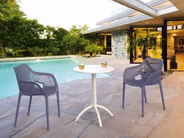 2 Grey Air XL Chairs and White Octopus Table Set in the Garden by the Pool