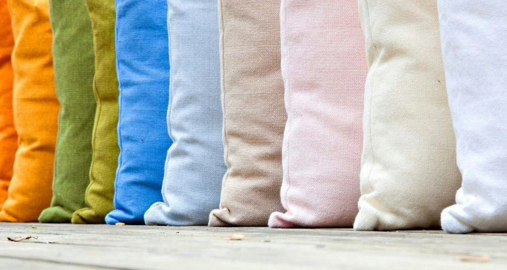 Row of multi coloured outdoor cushions