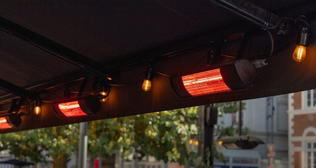 Row of electric infra red heaters in bar