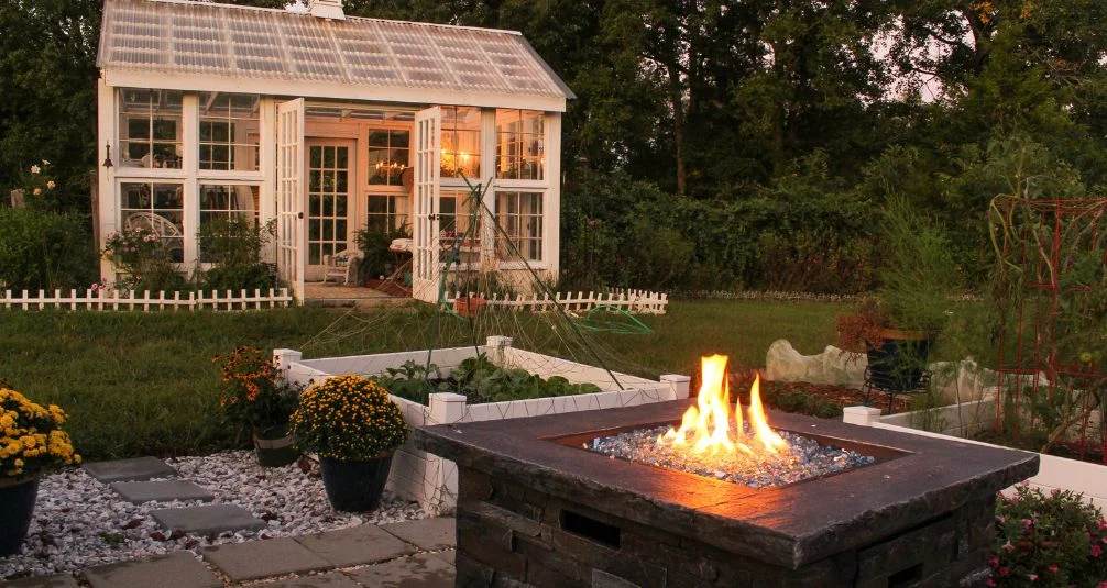 Square firepit table in beautiful garden