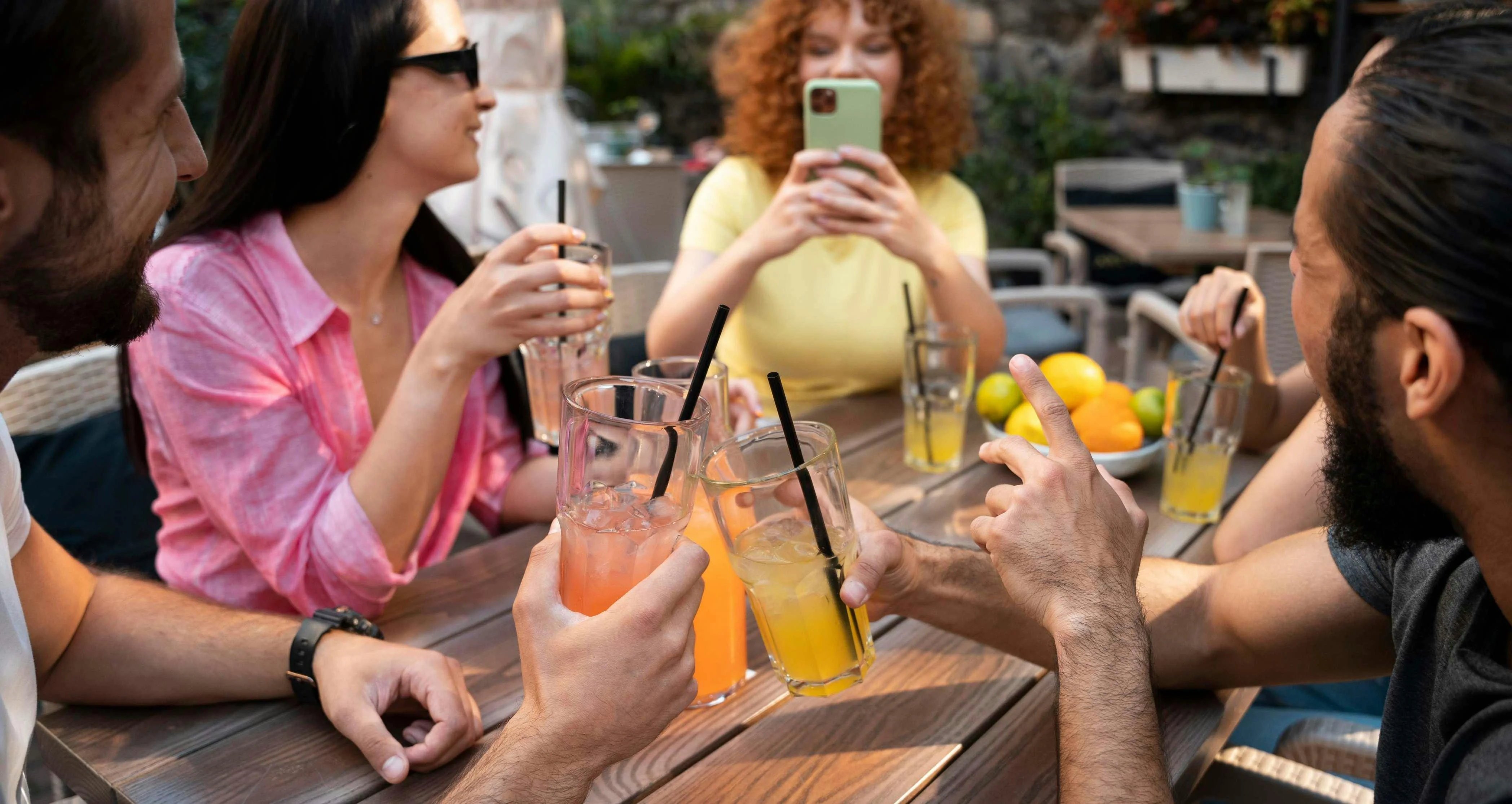 Friends Enjoying Drinks Outside Dining